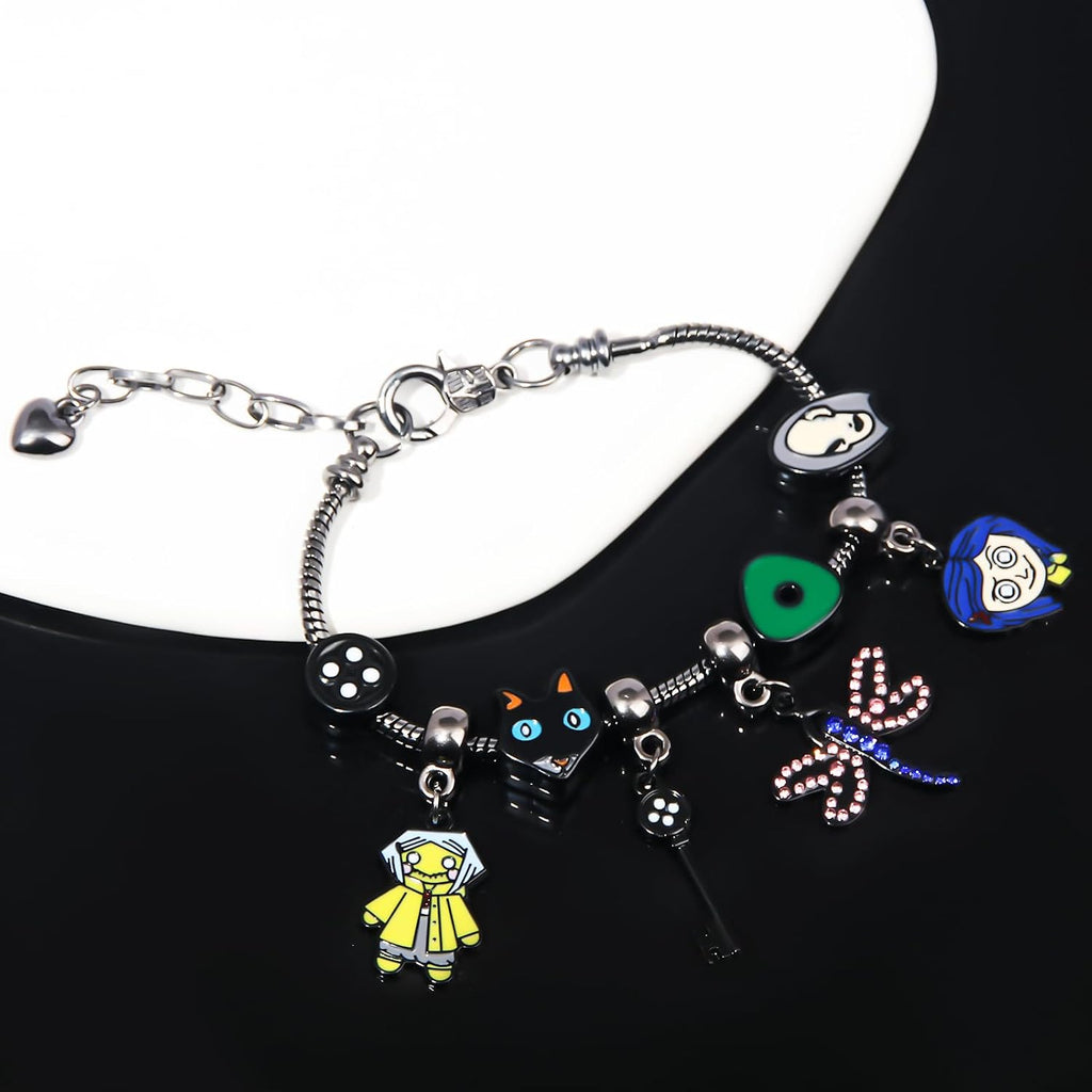 Dark Fantasy Button-Eye Charm Bracelet – Adjustable Storybook-Inspired Bracelet with Cat, Key & Dragonfly Charms