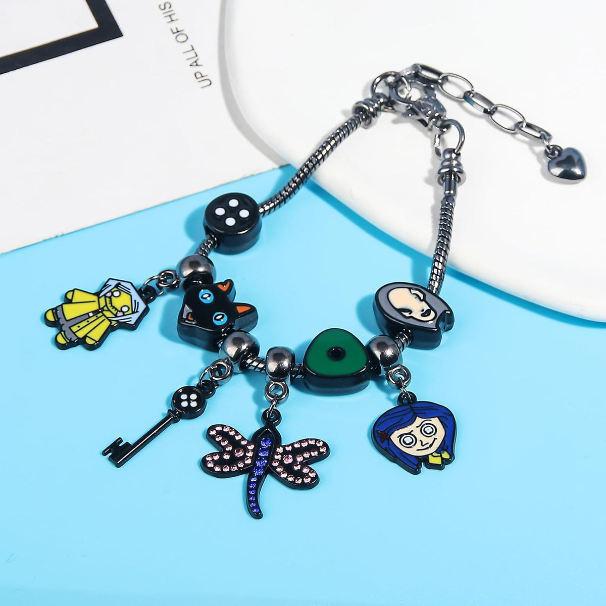 Dark Fantasy Button-Eye Charm Bracelet – Adjustable Storybook-Inspired Bracelet with Cat, Key & Dragonfly Charms