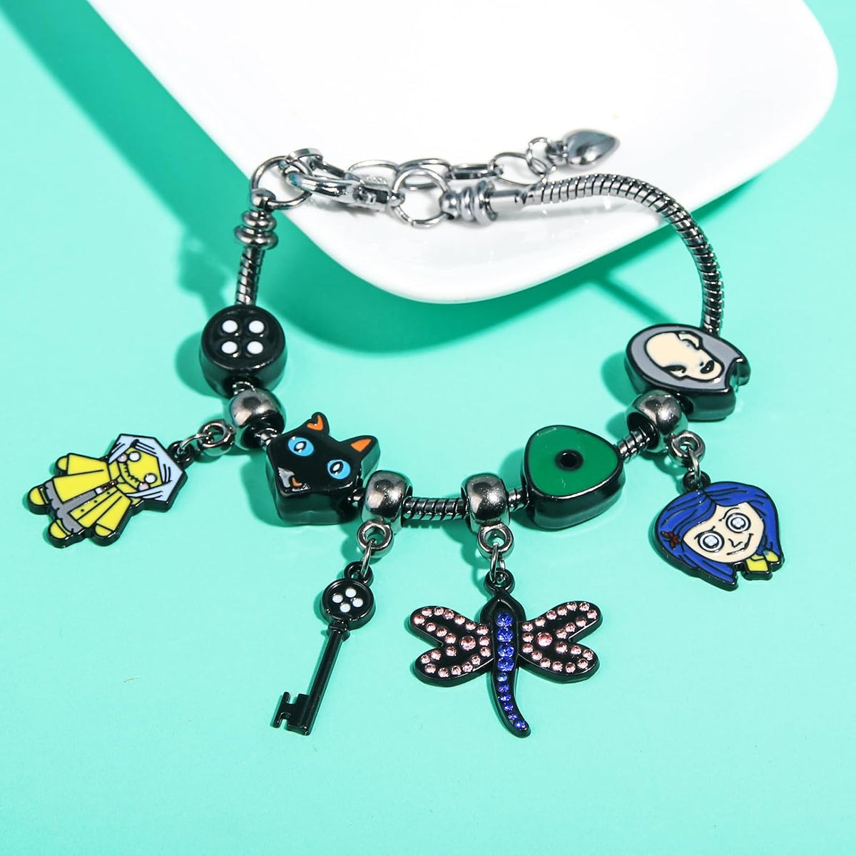 Dark Fantasy Button-Eye Charm Bracelet – Adjustable Storybook-Inspired Bracelet with Cat, Key & Dragonfly Charms